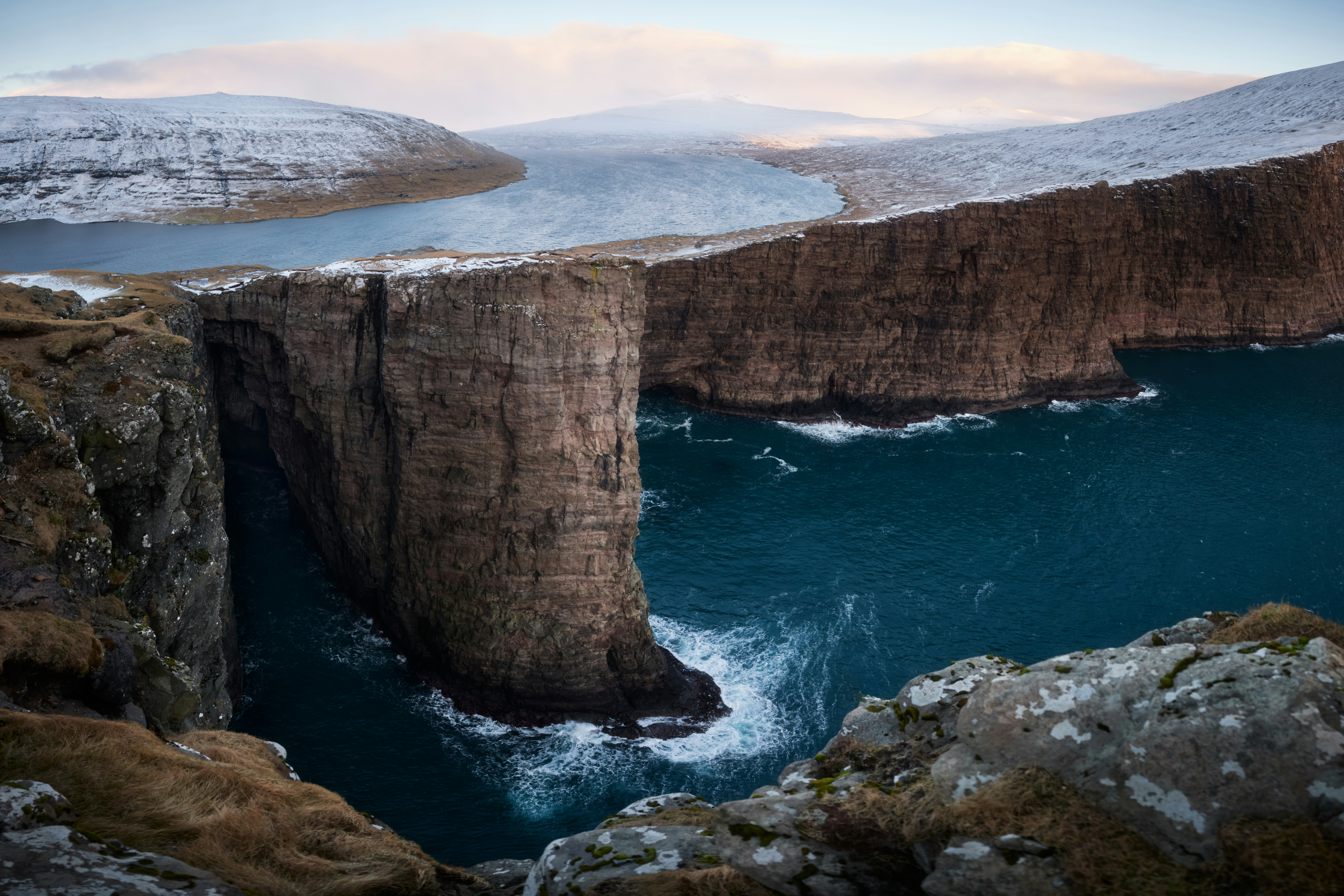 Traelanipa Cliff overlooking Lake Leitisvatn in the Faroe Islands